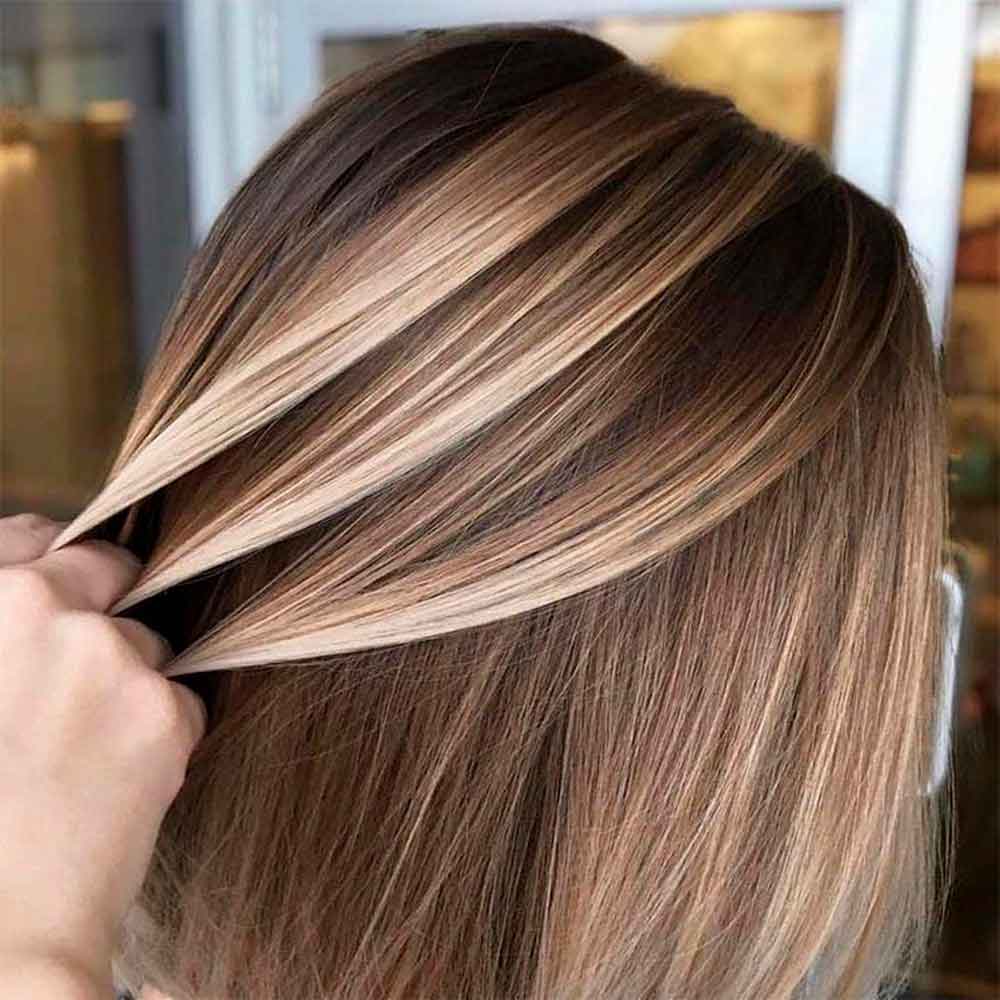 A woman with beautiful balayage hair color
