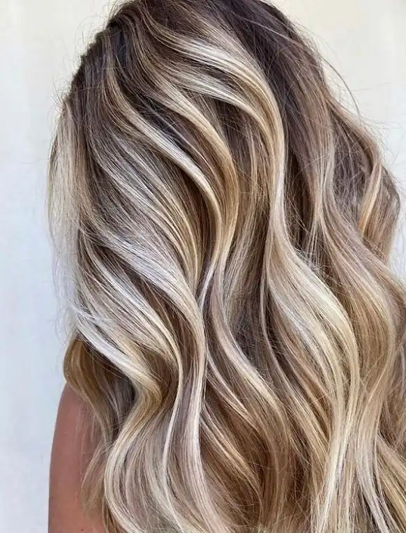 A woman with a blonde balayage technique