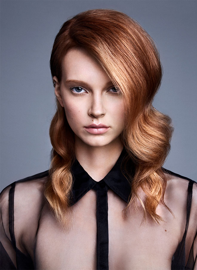 A woman with a copper balayage