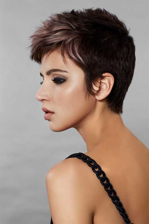 A woman with a modern pixie hairstyle and the Style Masters™ products used to create the look