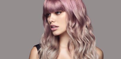 A woman with a mauve and icy hair color