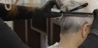 A woman having her gray hair beautified at the salon
