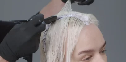 A woman with her hair being colored