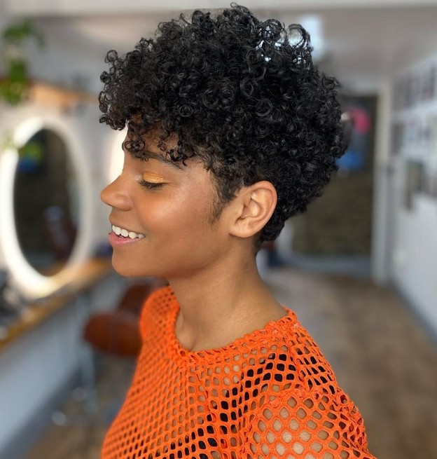 woman with coily hair and a pixie cut