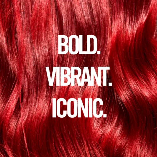 Bold Crimson Red hair under text that reads “Bold. Vibrant. Iconic.”