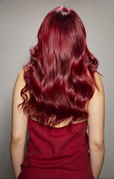 Revlon Professional’s 2026 Hair Color of the Year, Bold Crimson Red, on a model